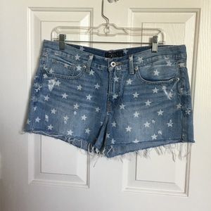 Star printed cutoff denim shorts